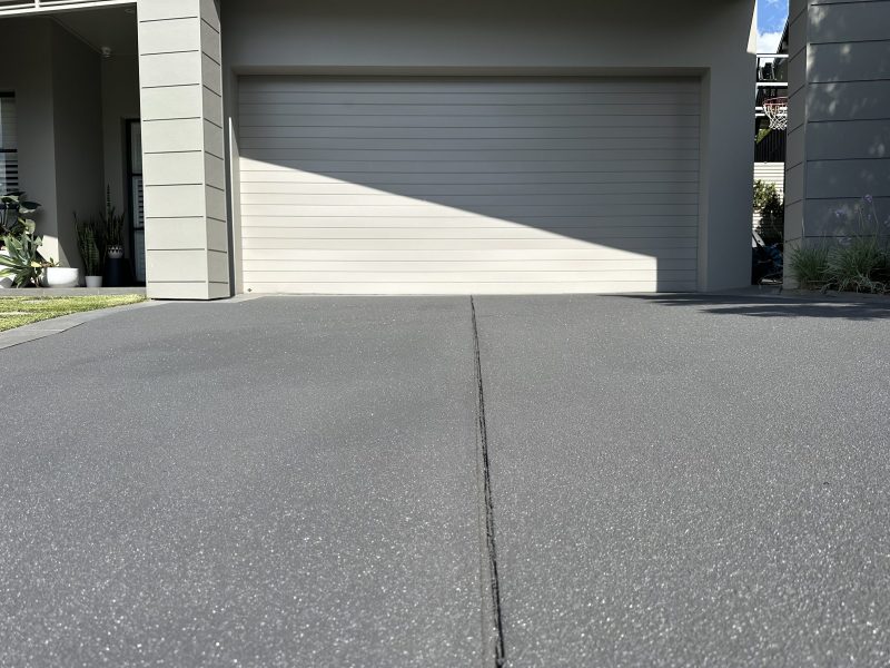 Pebblecrete driveway after resurfacing, with the pebble texture flattened