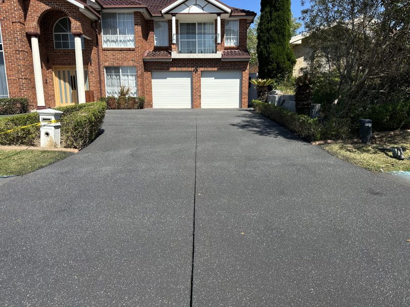 Driveway resurfaced in a fleck finish with speckle through the surface